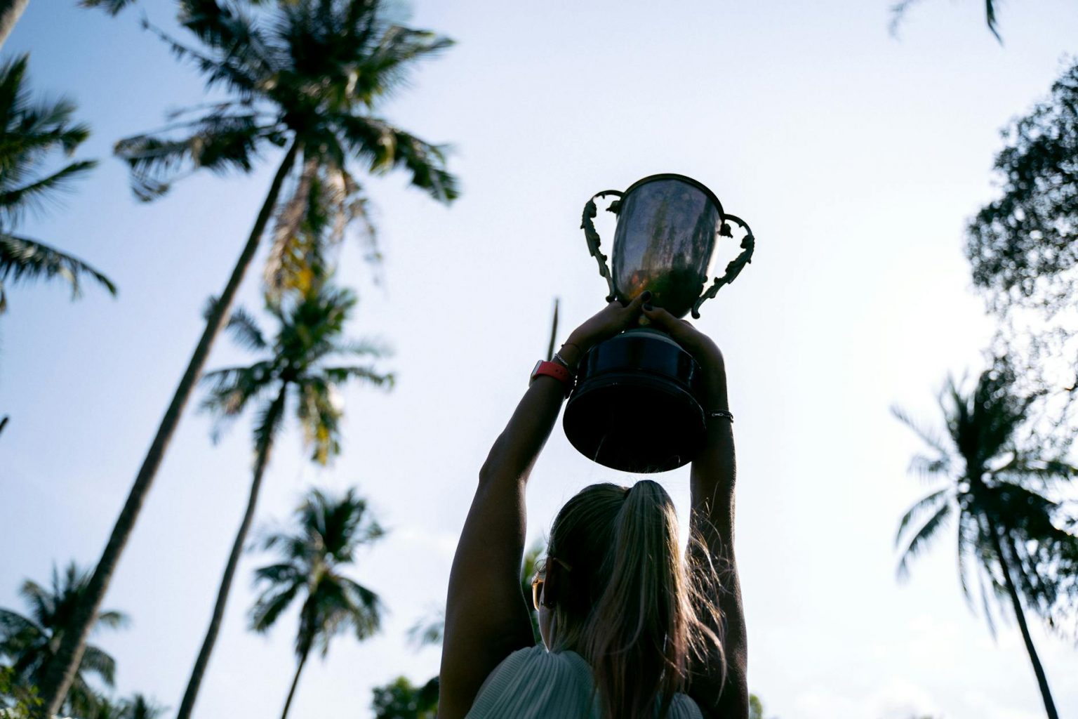 a woman holding a trophy